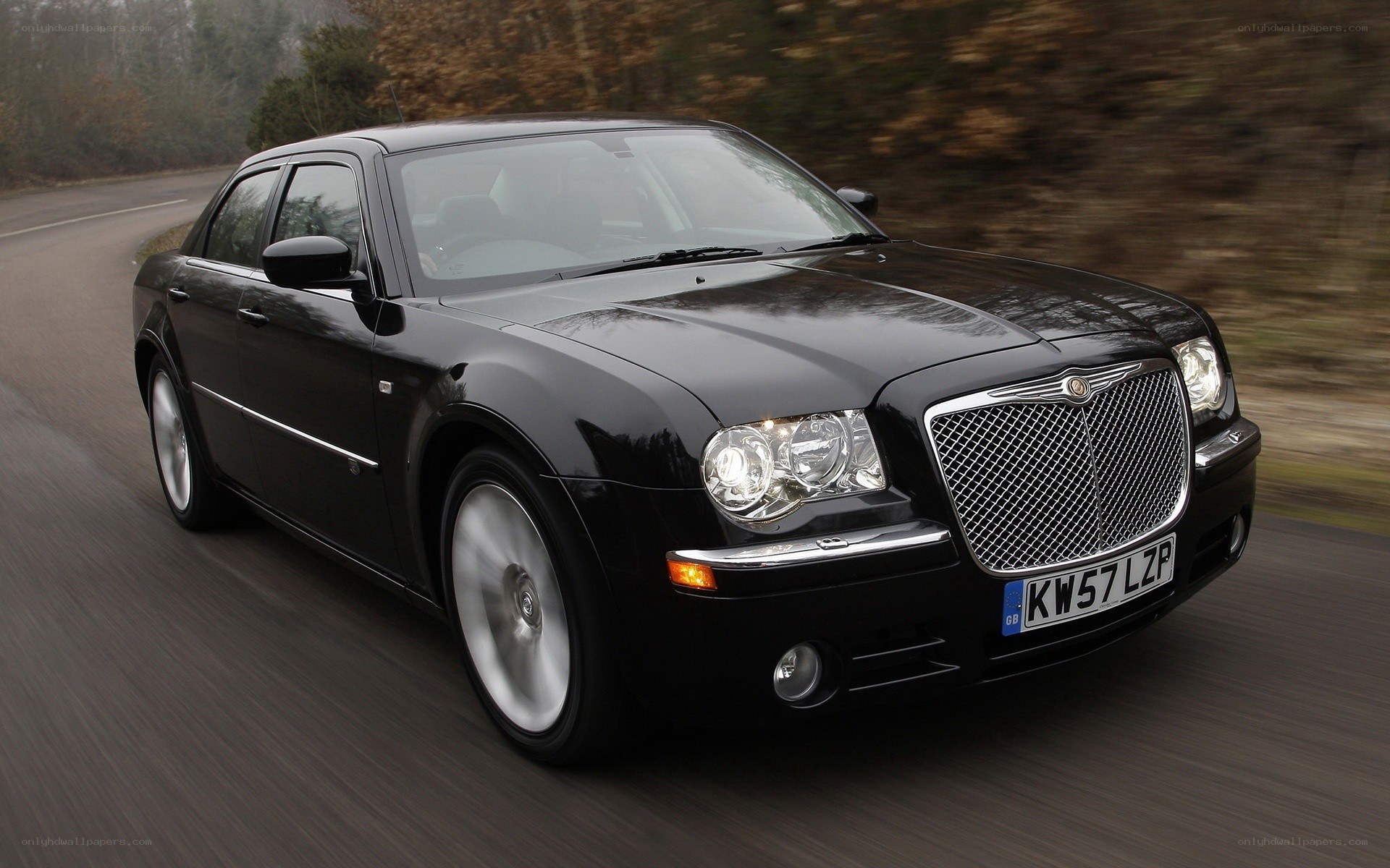 black chrysler 300 in motion