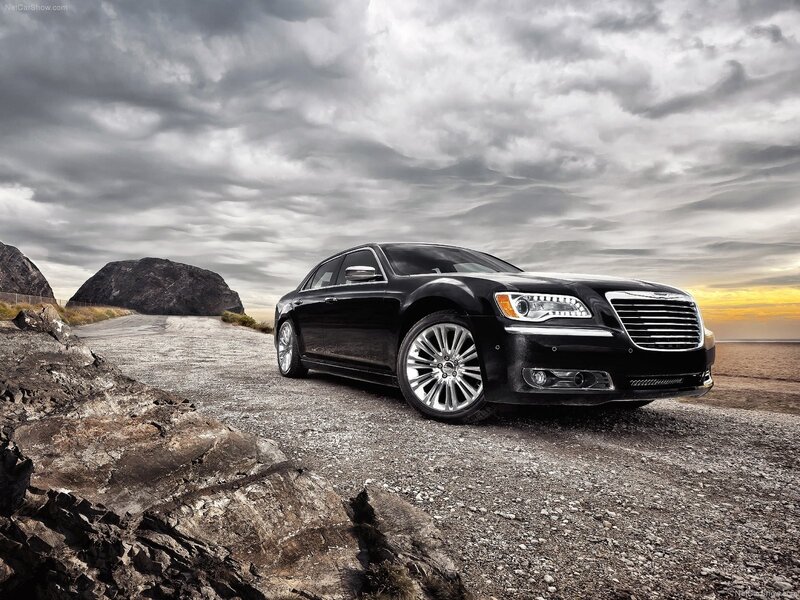 Black Chrysler 300 on a coastal road