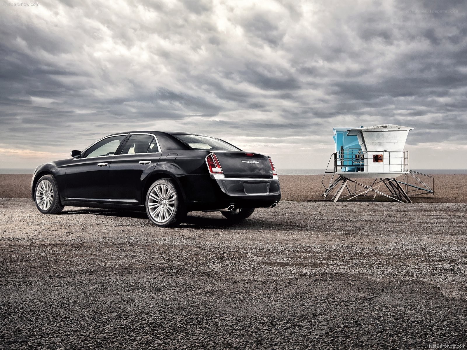 Black Chrysler 300 on beach