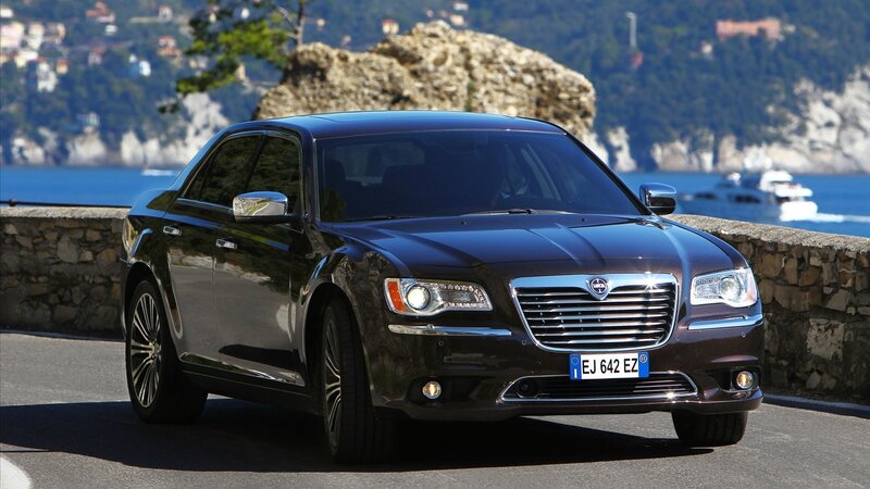 Black Chrysler 300 on coastal road