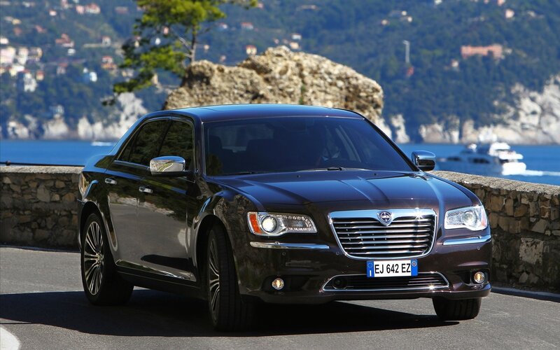 Black Chrysler 300 on coastal road