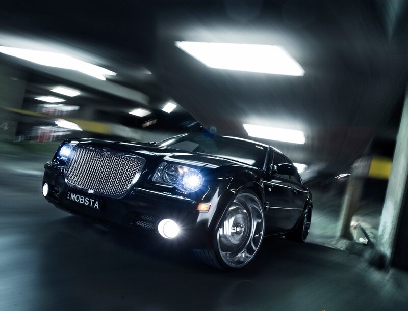 Black Chrysler in motion