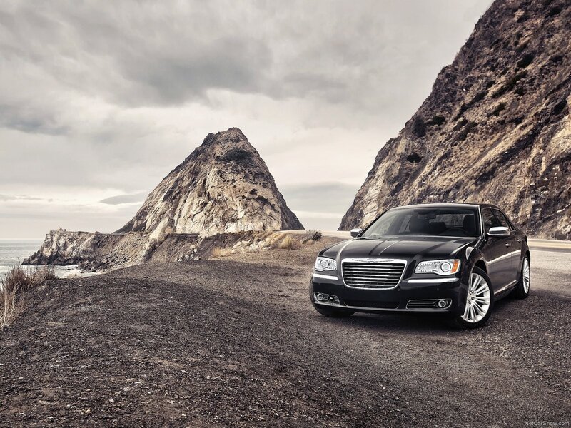 Black Chrysler on coastal road