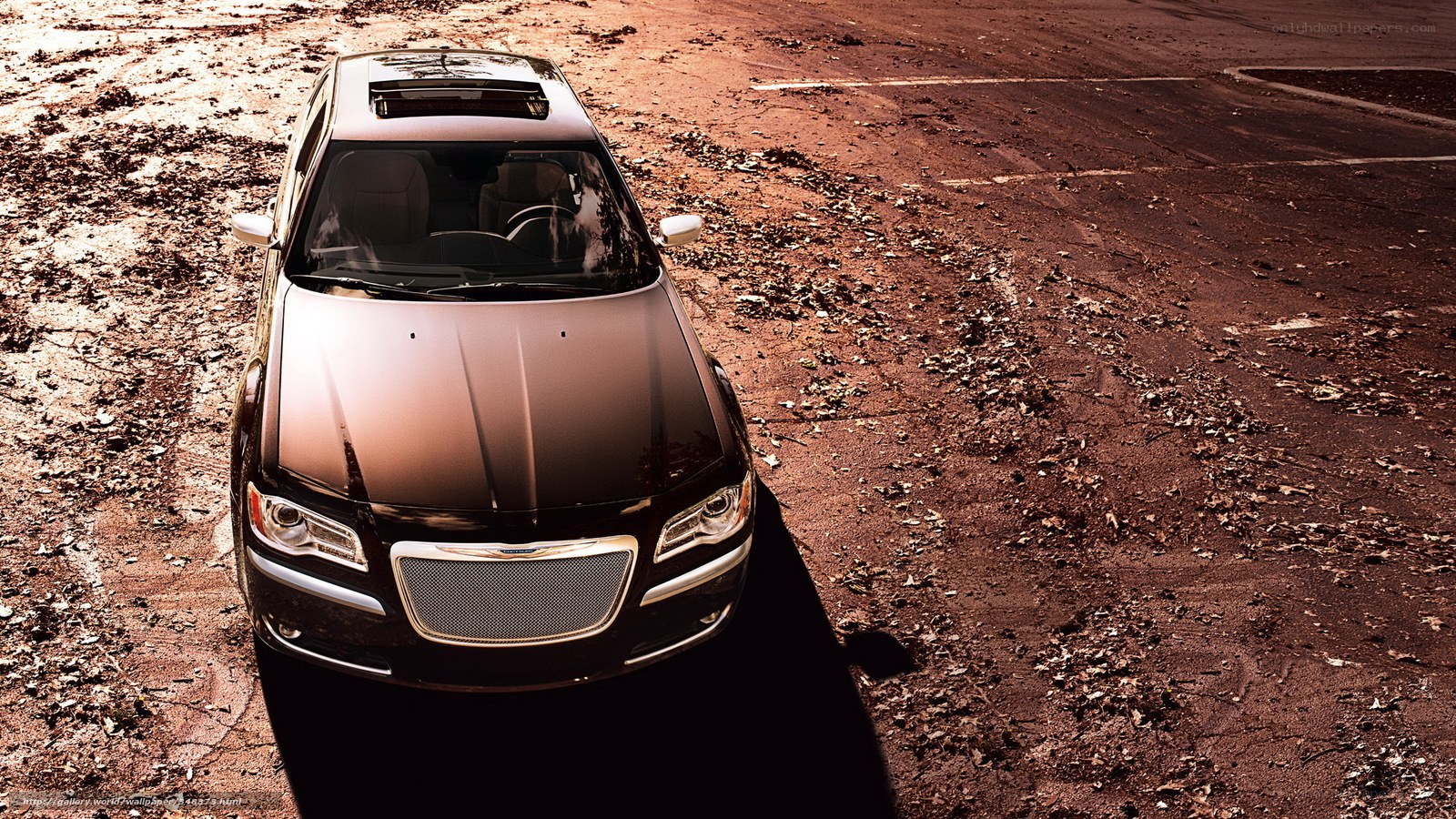 black chrysler on dirt road