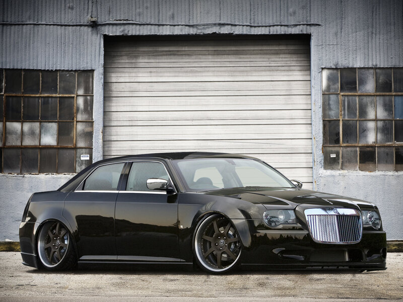 black chrysler sedan in garage