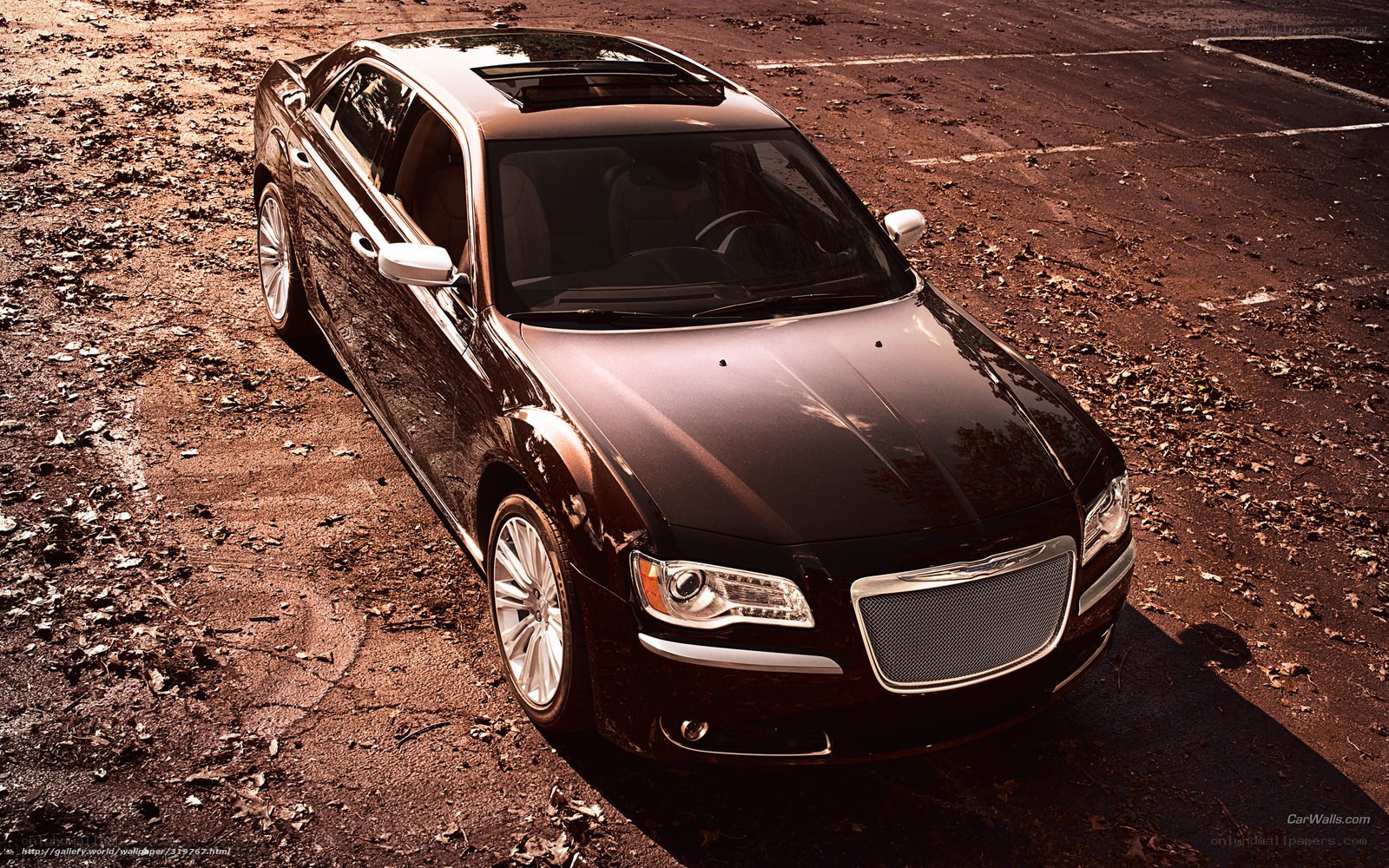 black chrysler sedan on dirt