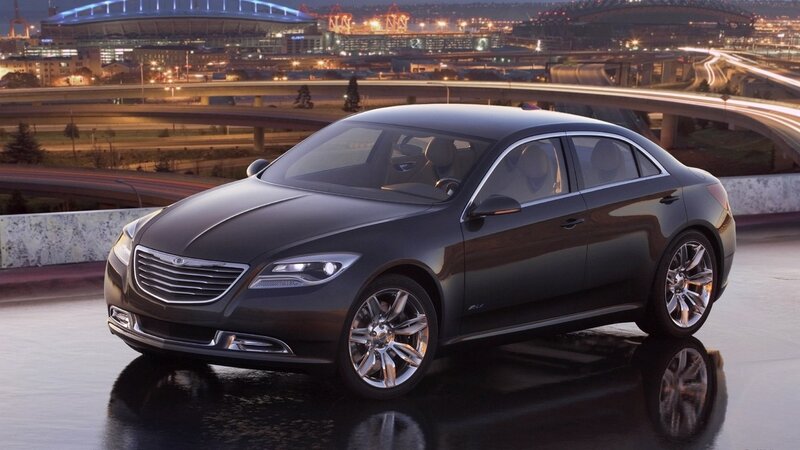 Black Chrysler sedan on wet road