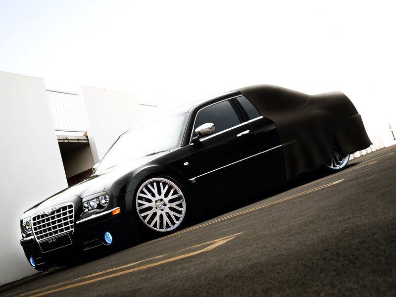 black chrysler with custom wheels
