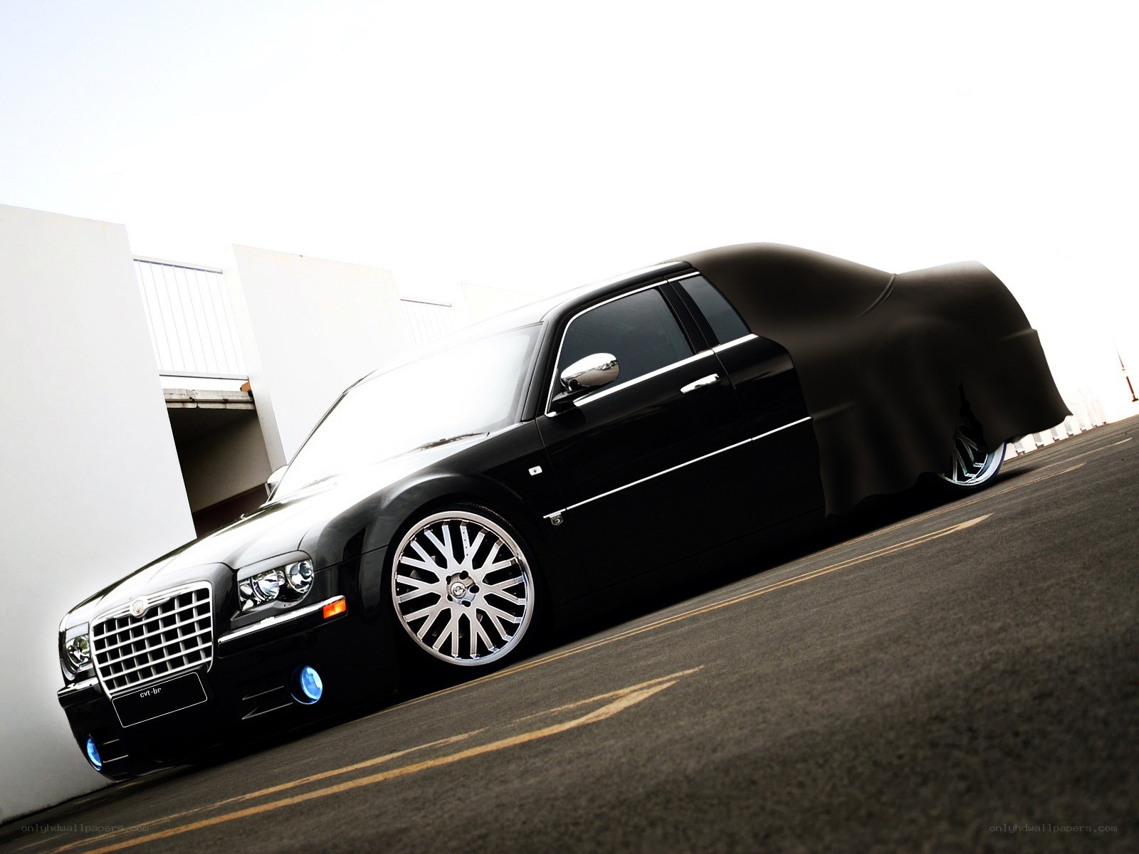 black chrysler with custom wheels