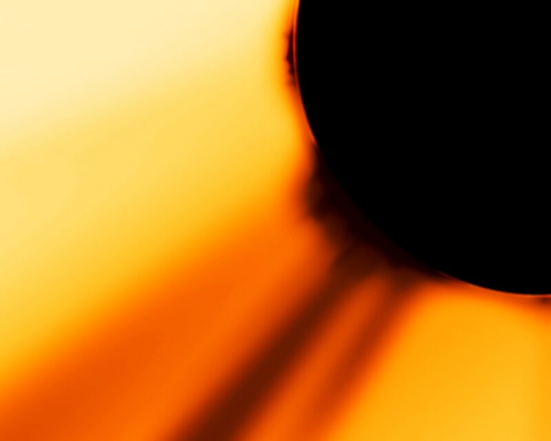 Black Circle on Orange Background