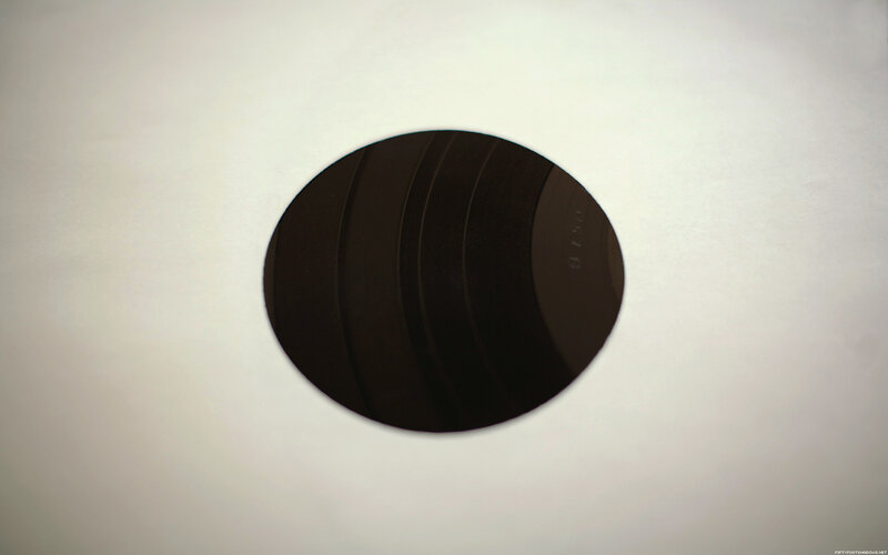 black circular object on white surface