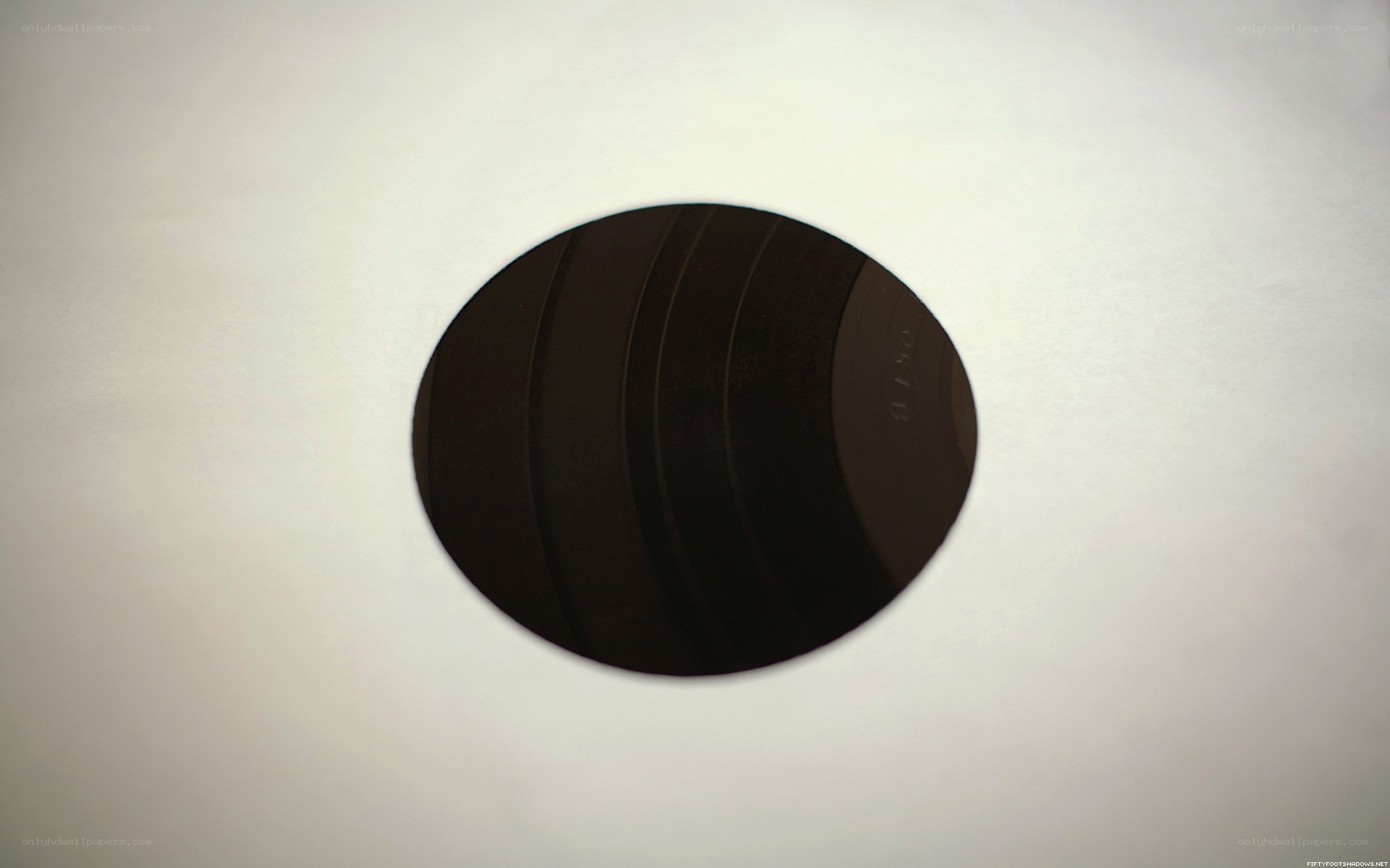 black circular object on white surface