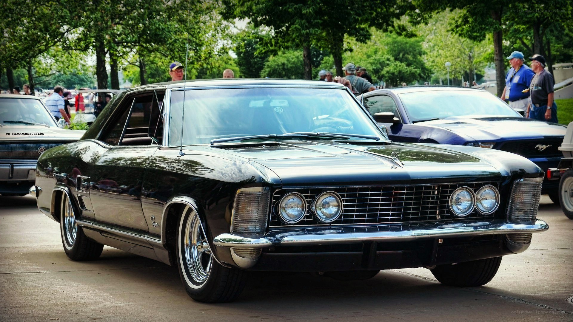 Black classic car at a show