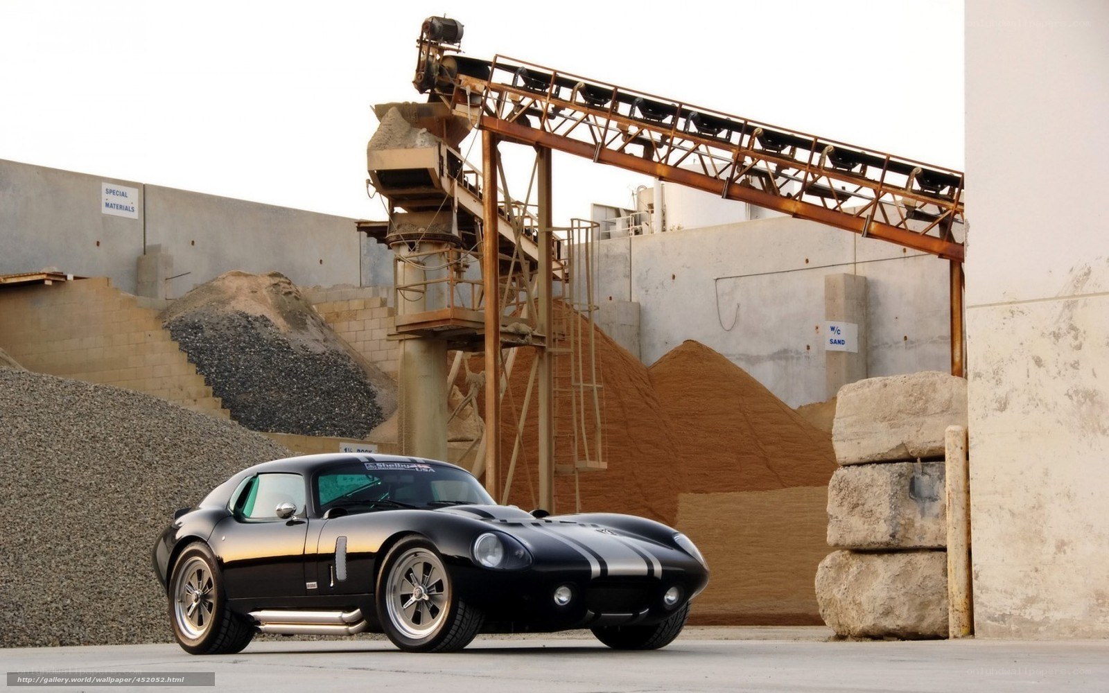 Black classic car at construction site