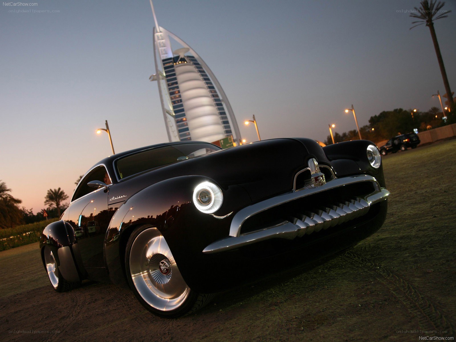 Black classic car at dusk