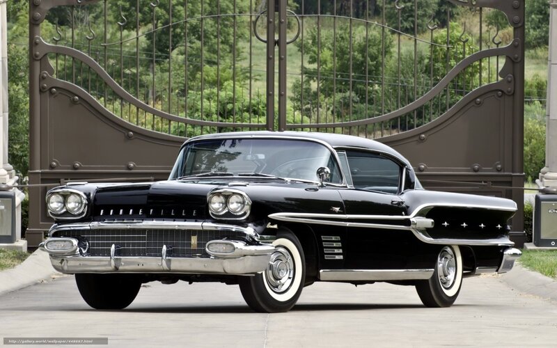 Black classic car at gate