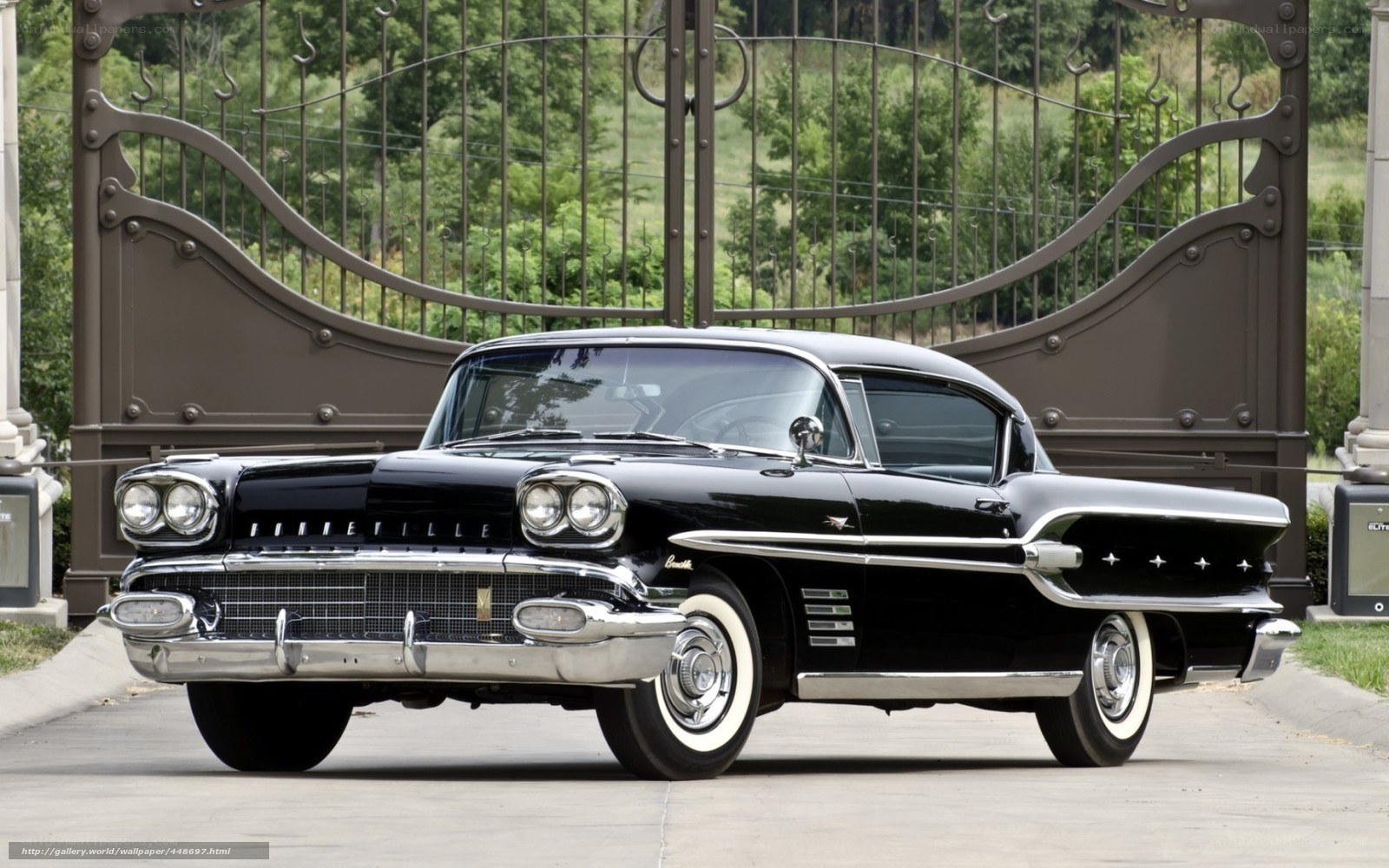 Black classic car at gate