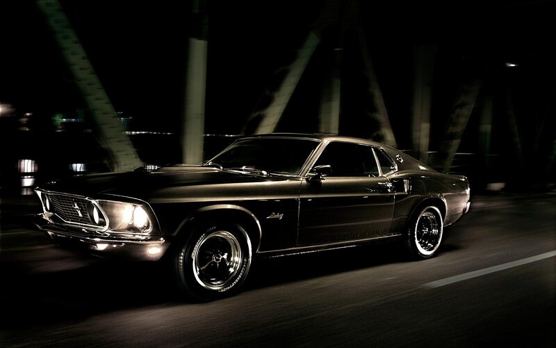 Black classic car at night