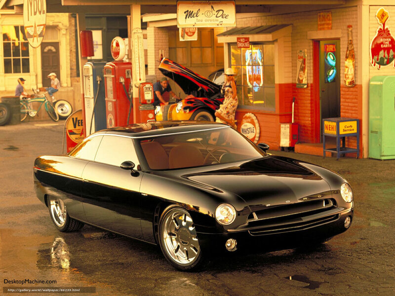 Black classic car at vintage gas station
