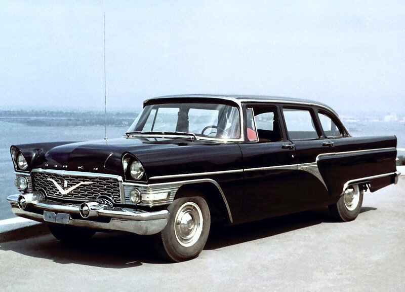 Black classic car by the water