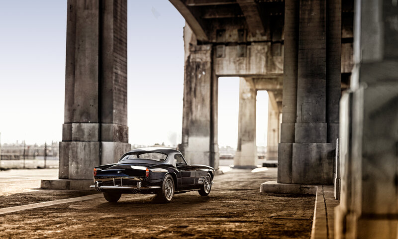 Black Classic Car — Dramatic, Afternoon, Photograph, Concrete Pillars, Bridge Structure