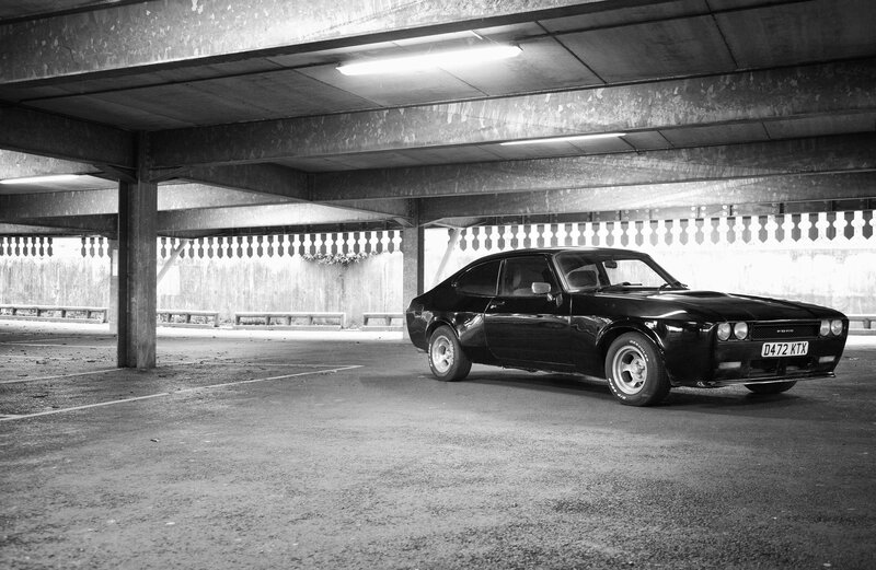 Black Classic Car — Dramatic, Photograph, Parking Garage