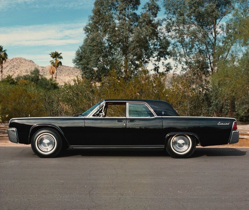 Black classic car in desert