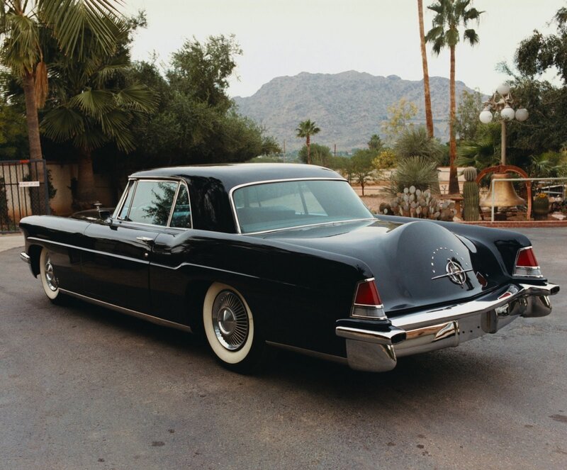 Black classic car in desert setting