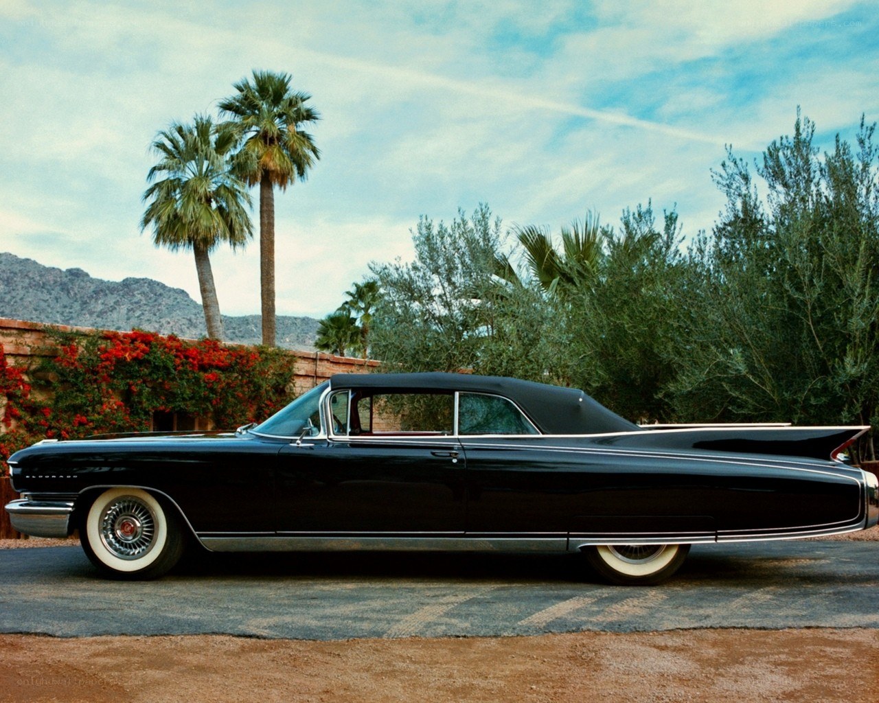 Black classic car in desert setting