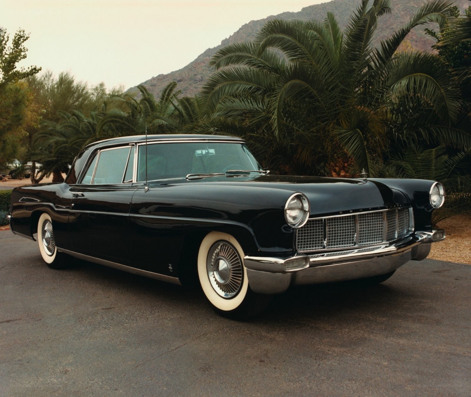Black classic car in desert