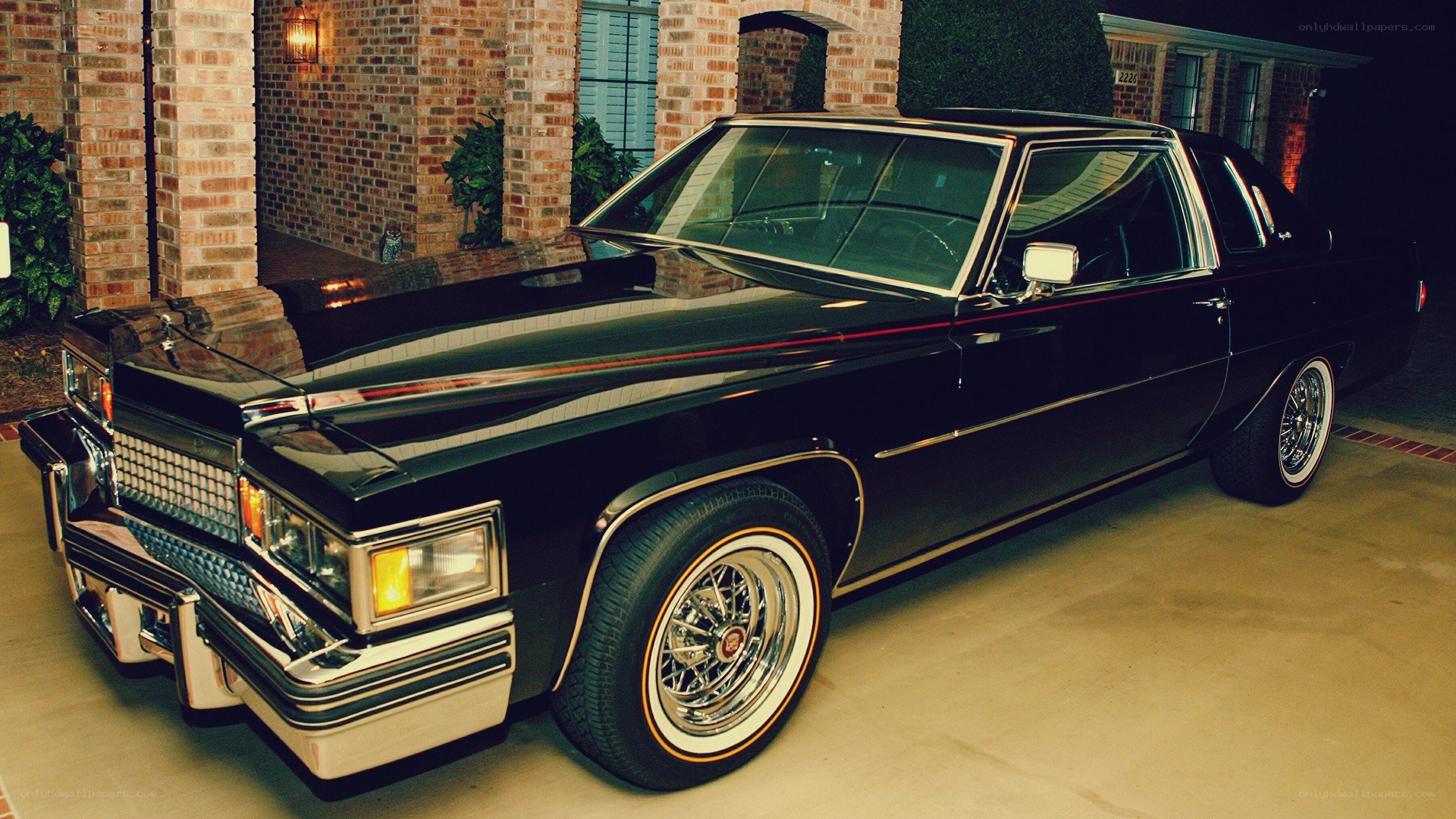 black classic car in driveway