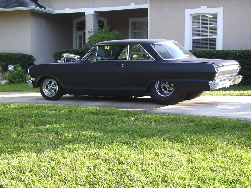 black classic car in driveway