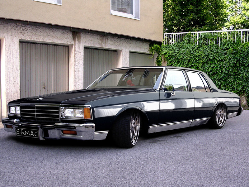 black classic car in driveway