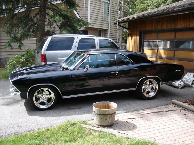 black classic car in driveway