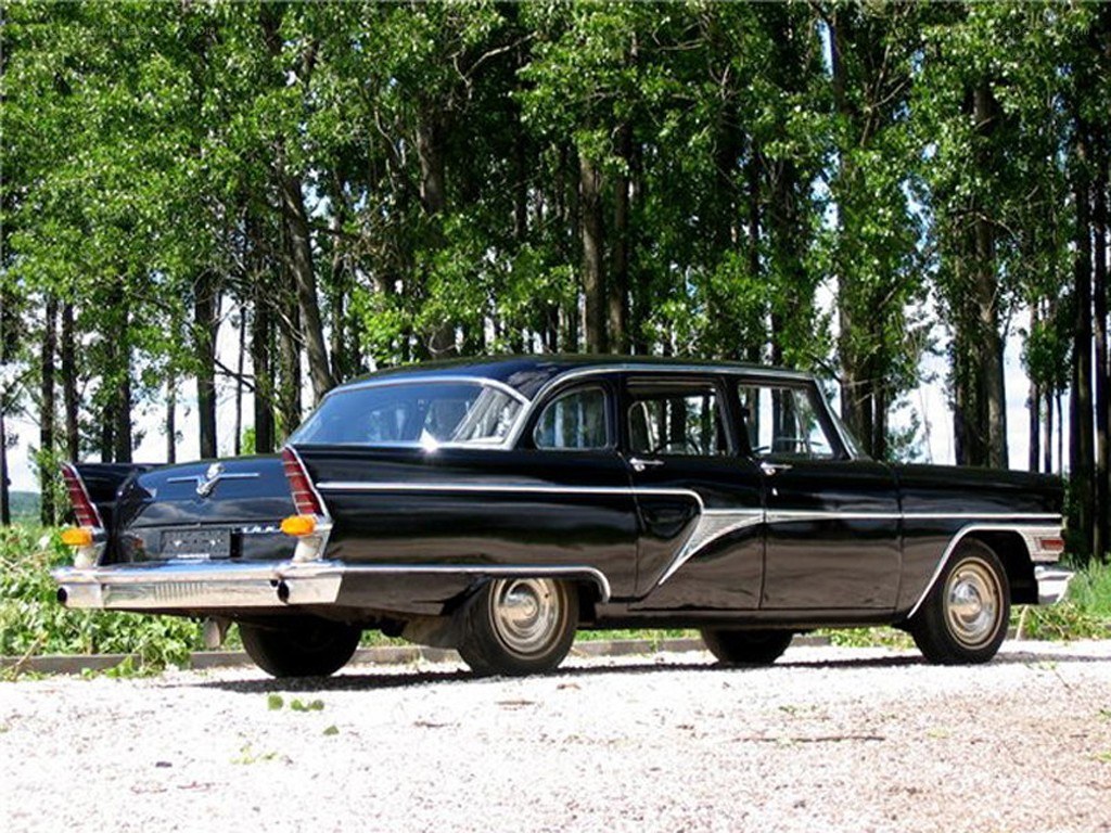 black classic car in forest