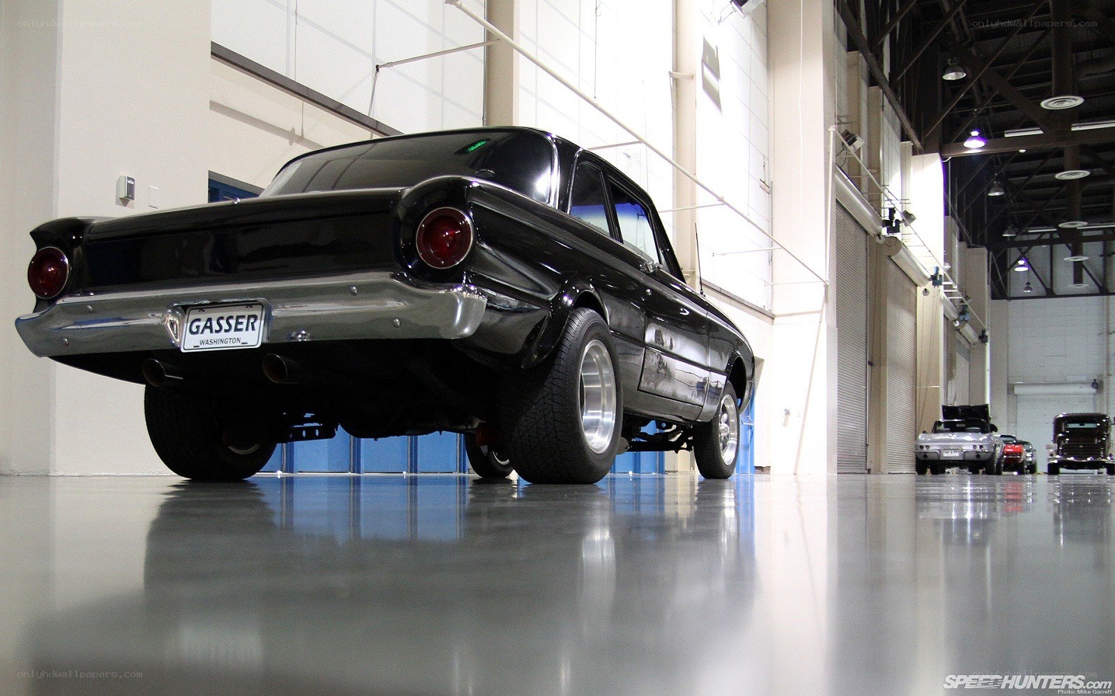 Black classic car in garage