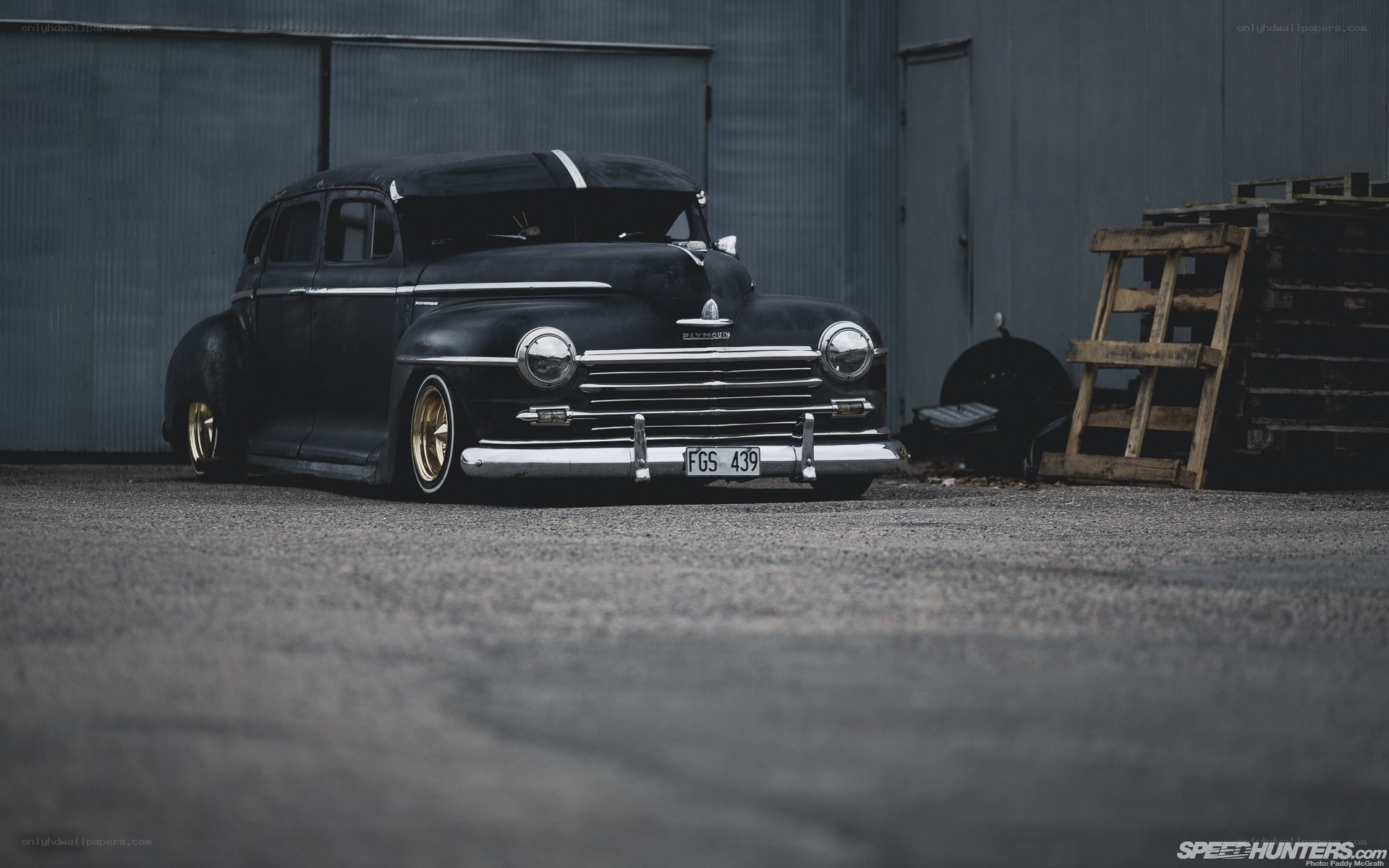 Black classic car in garage