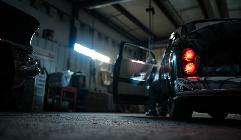 Black Classic Car in Garage — Dramatic