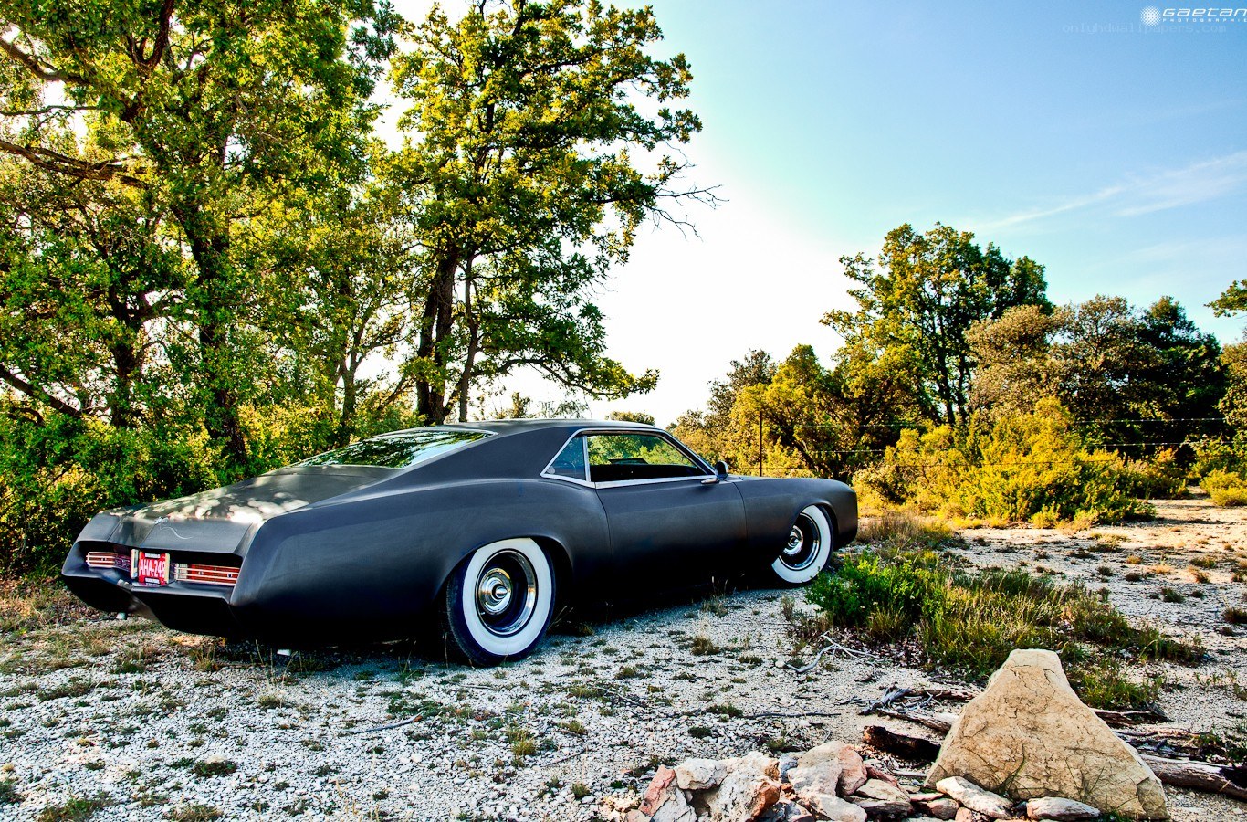 Black classic car in nature