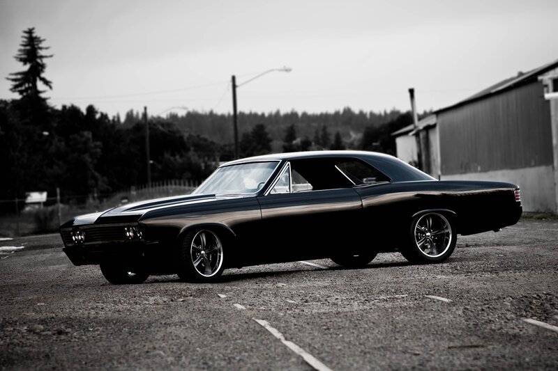 black classic car in parking lot