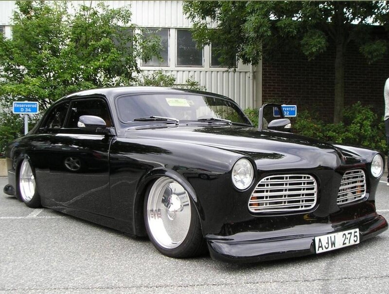 black classic car in parking lot