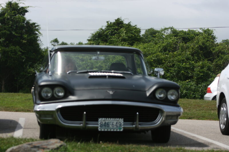 black classic car in parking lot