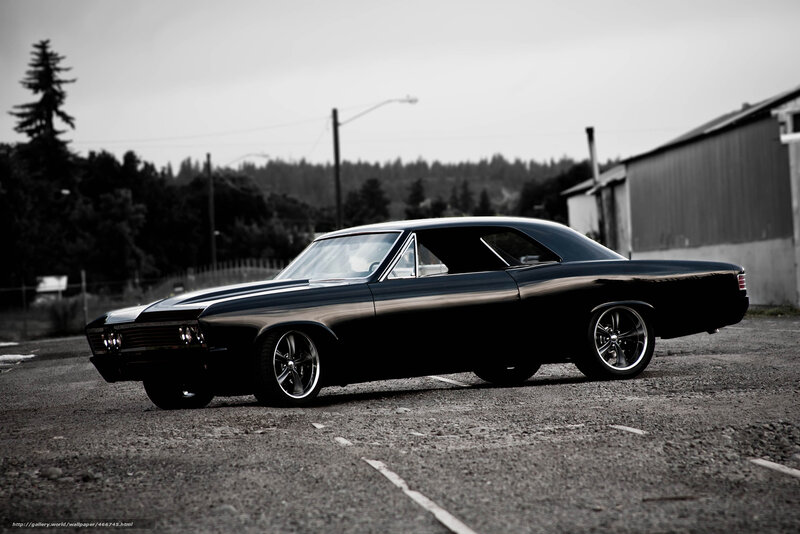 black classic car in parking lot