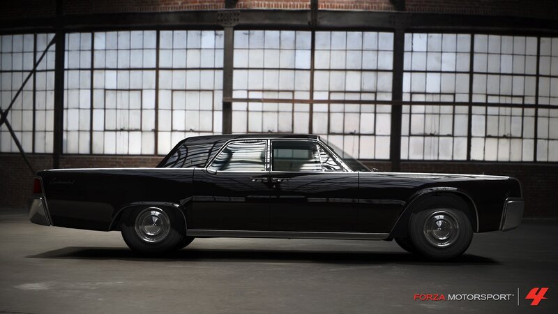 black classic car in warehouse