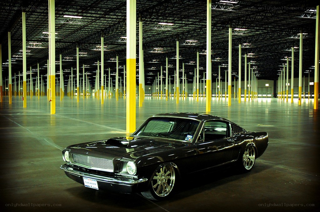 Black classic car in warehouse