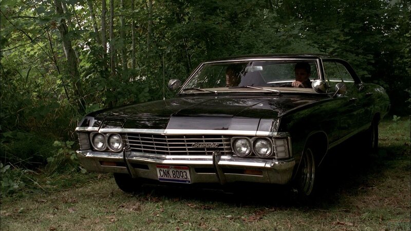 Black Classic Car in Woods