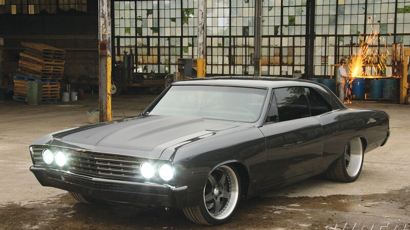 black classic car in workshop