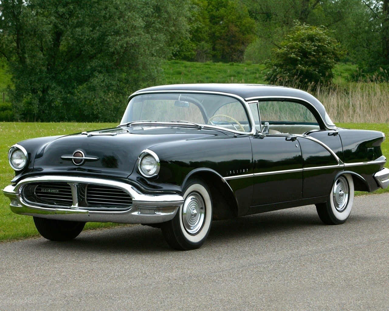 Black classic car on a road