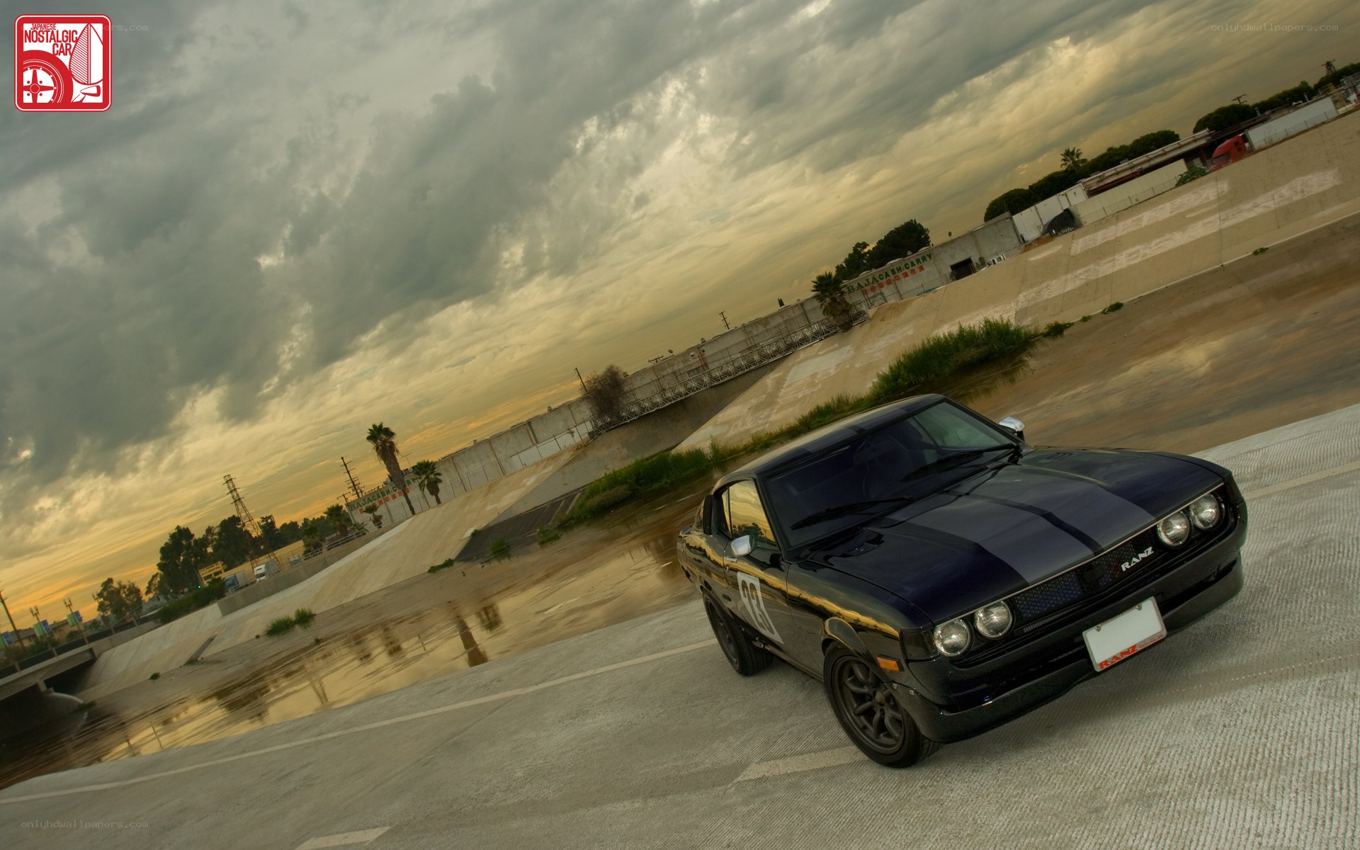 Black classic car on concrete