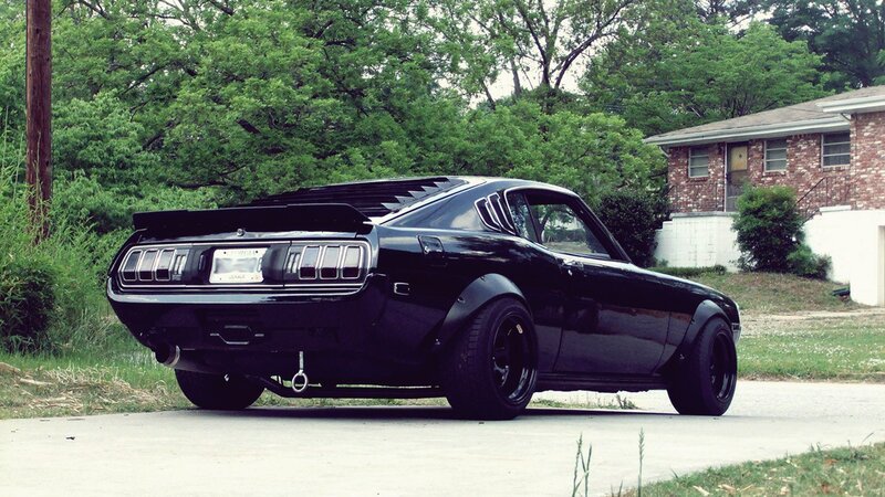 black classic car on driveway